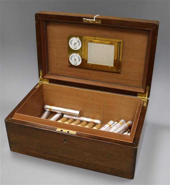 A Dunhill figured burr walnut humidor with old cigars